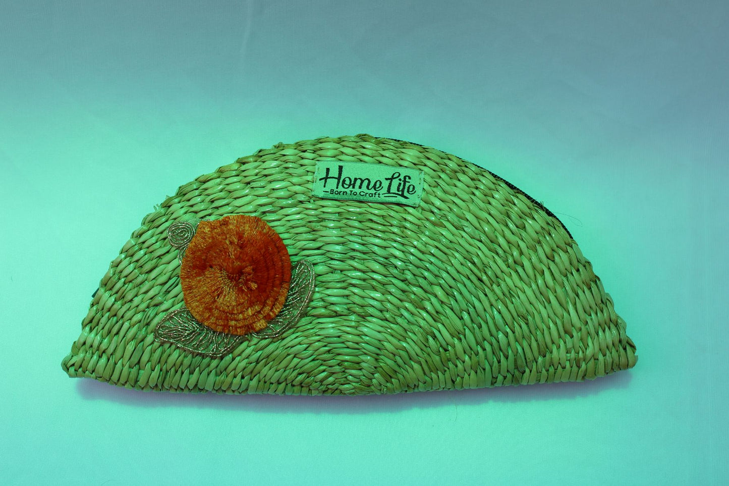 Handwoven clutch with flower appliqua