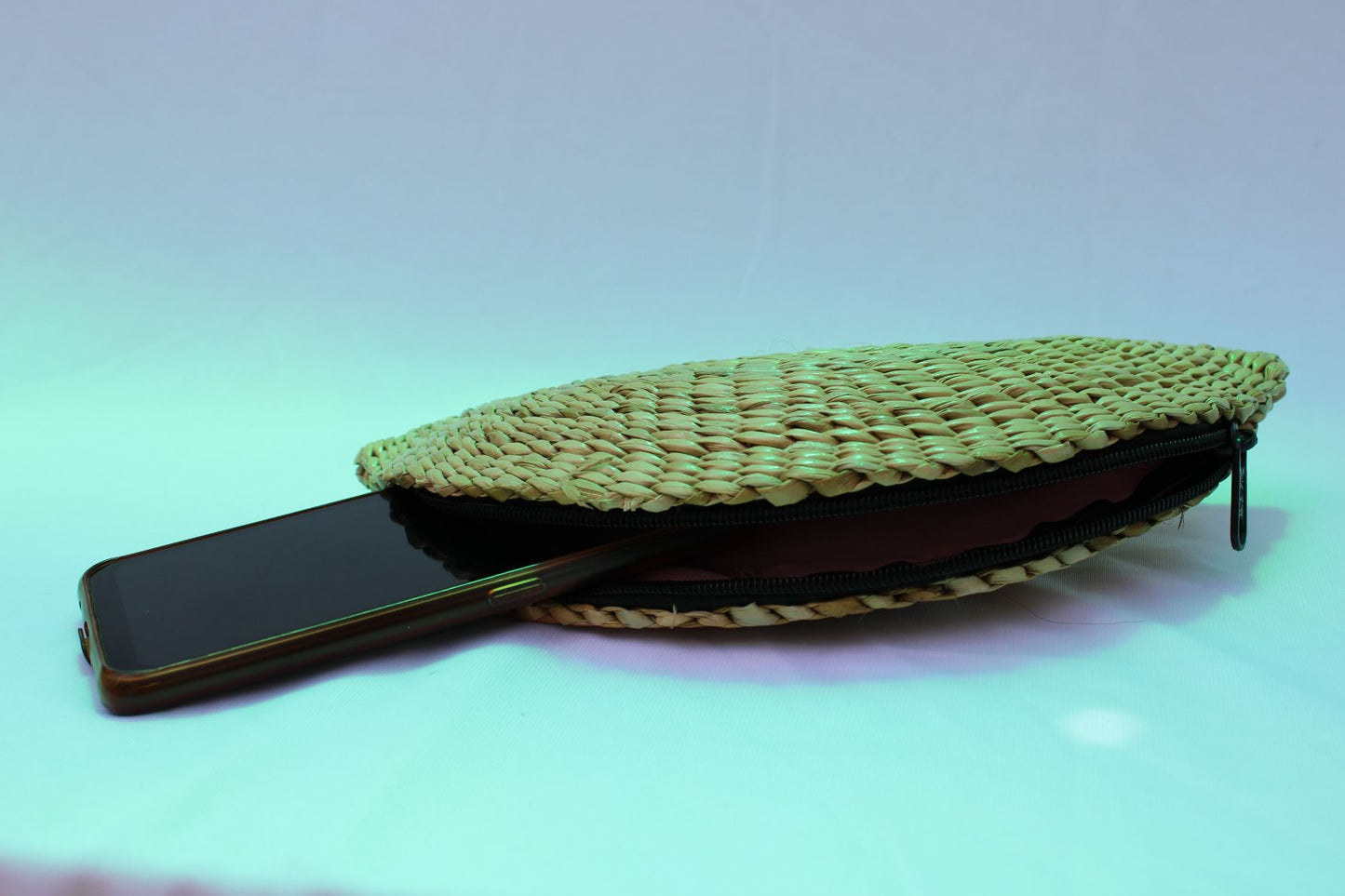 Handwoven clutch with flower appliqua
