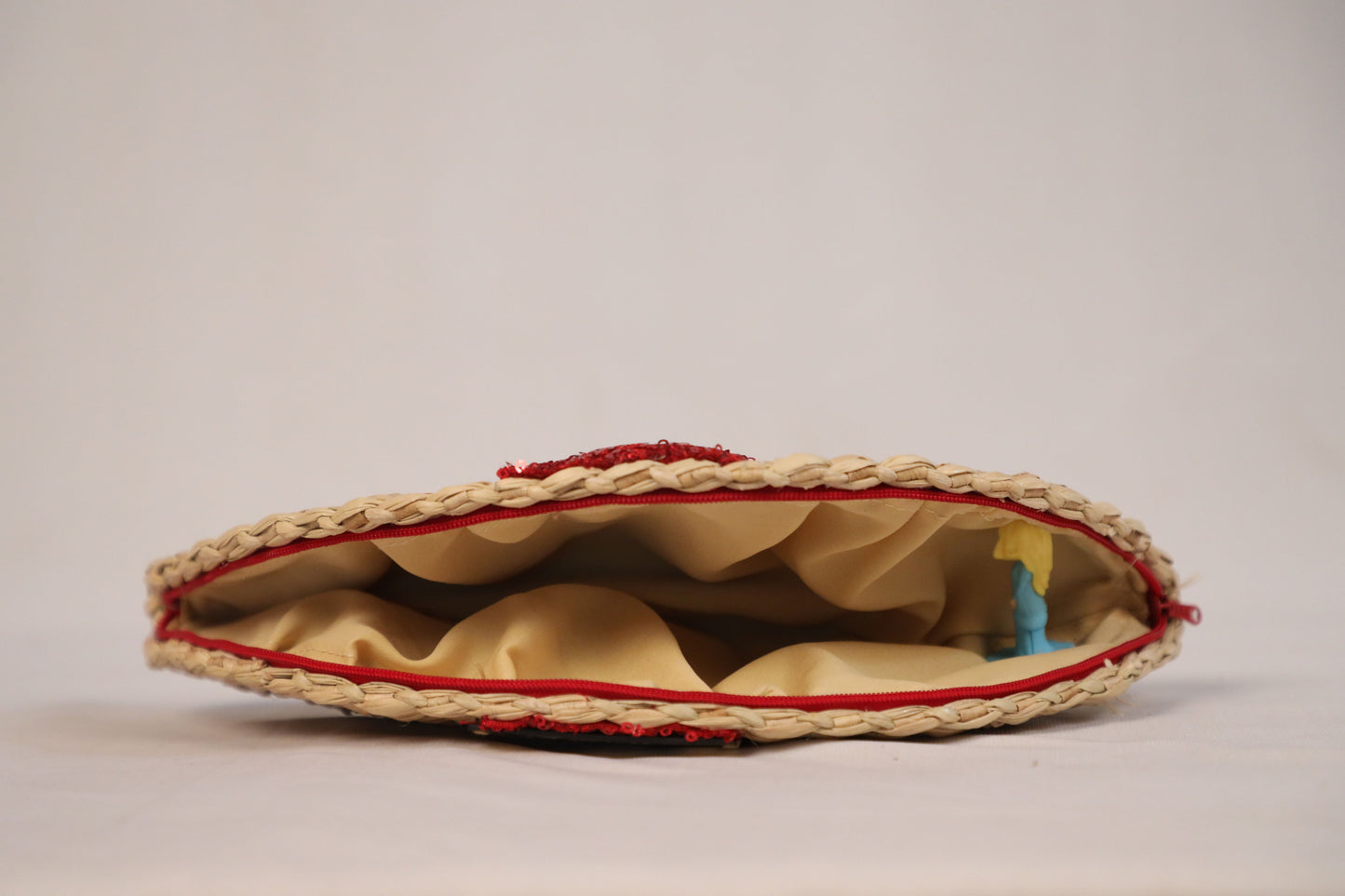Handwoven evening clutch with red sequin work