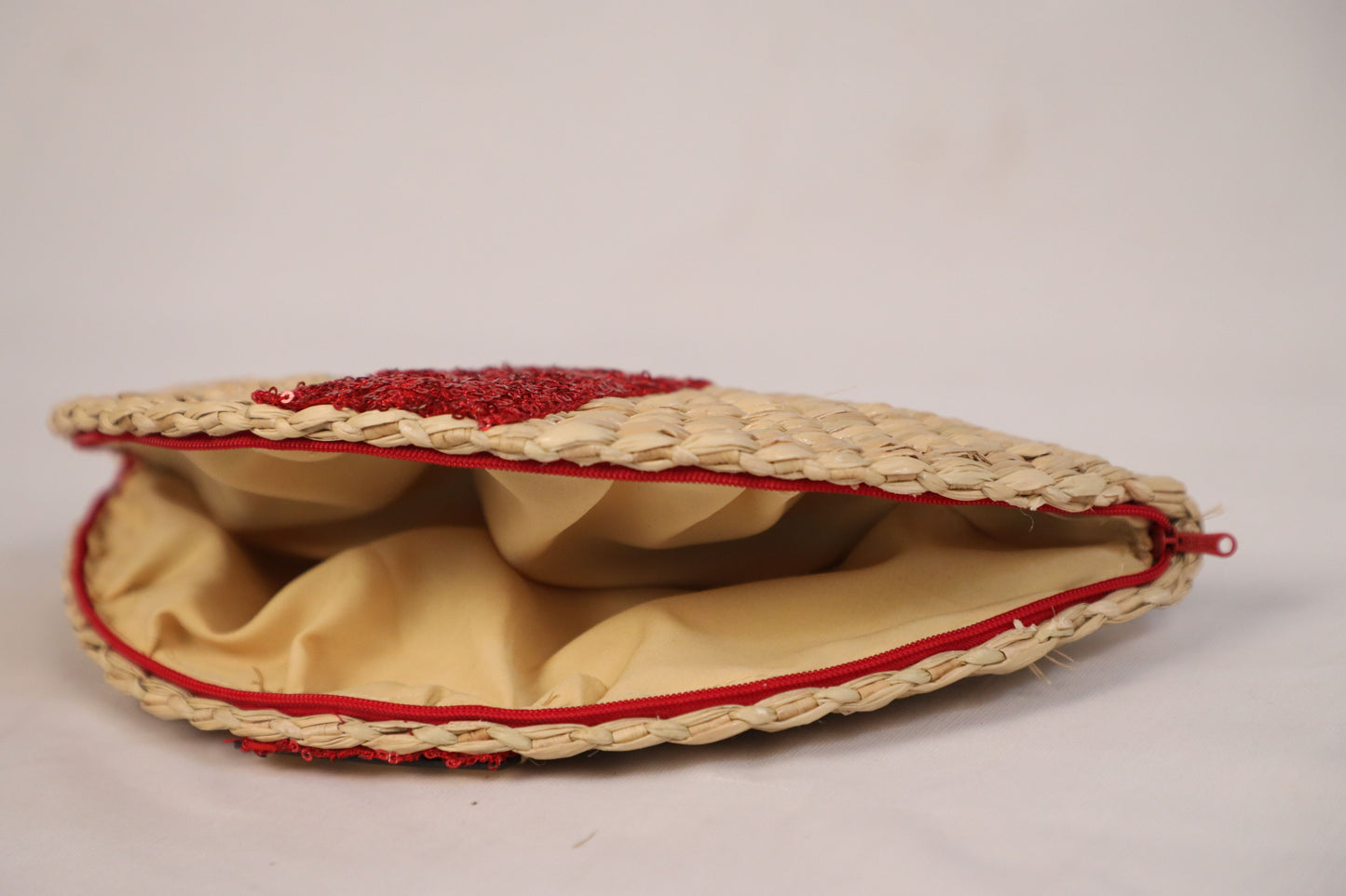 Handwoven evening clutch with red sequin work