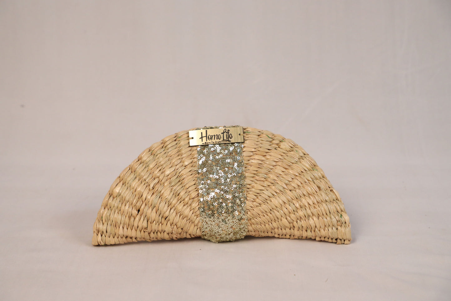 Handwoven evening clutch with golden sequin work